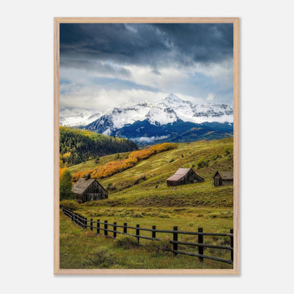 Framed Giclée art print of rustic barns and snow-capped peaks in Telluride, Colorado's stunning wilderness landscape.