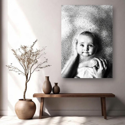Black-and-white baby bath photography metal print showcasing joy and innocence, displayed in a stylish home setting.