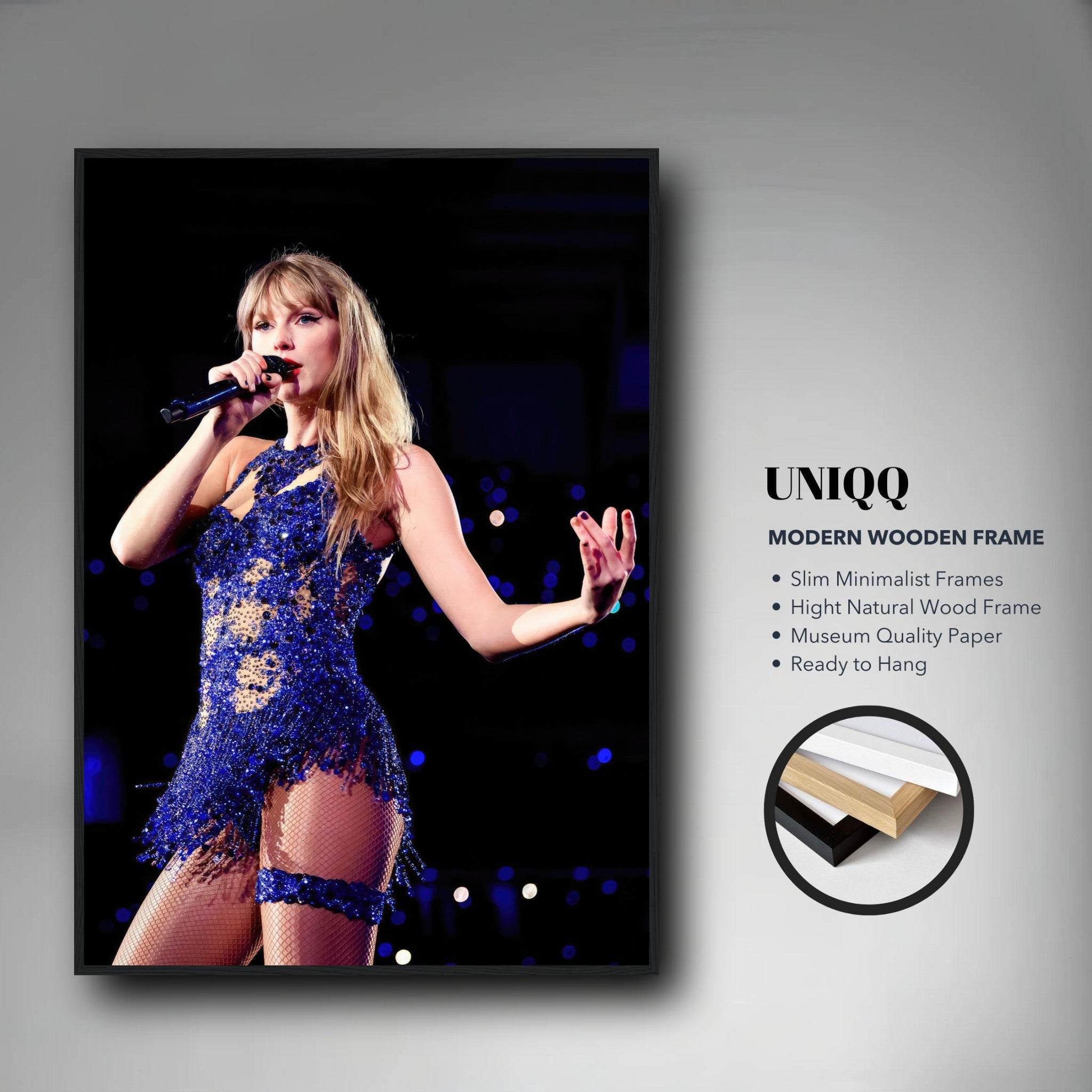 Taylor Swift performing in a dazzling blue costume, framed print showcasing vibrant colors and detail. Perfect for fans.