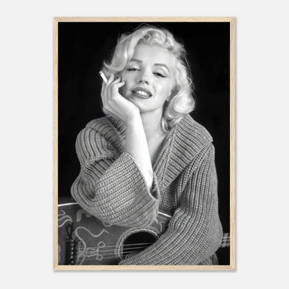 Marilyn Monroe smoking in a cozy knit sweater, framed black-and-white poster showcasing timeless elegance and iconic style.