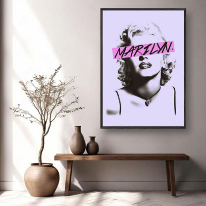 Vintage framed print of Marilyn Monroe with pink graphic detail, displayed in a stylish living room setting.