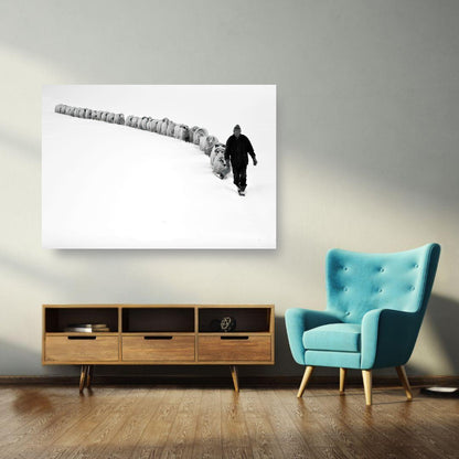 Black-and-white metal print of a shepherd walking in snow with his flock, showcasing unity and resilience in nature.