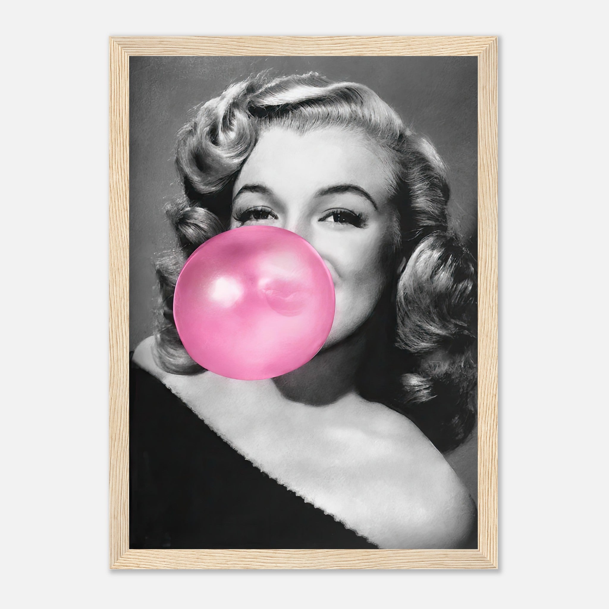 Marilyn Monroe framed print featuring her blowing pink bubble gum, adding a touch of vintage glamour to your décor.