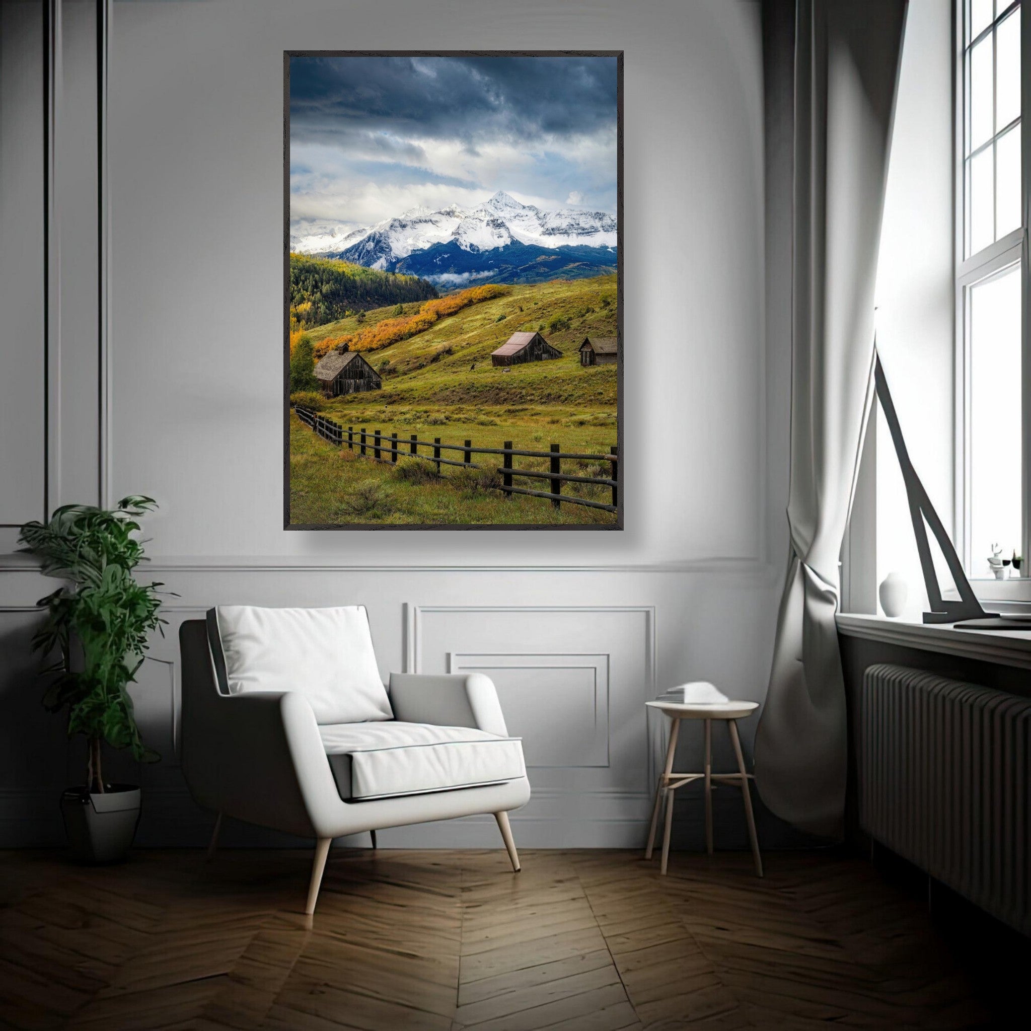 Framed Giclée fine art print of Telluride, Colorado, showcasing rustic barns and snow-capped peaks in a stylish living room.