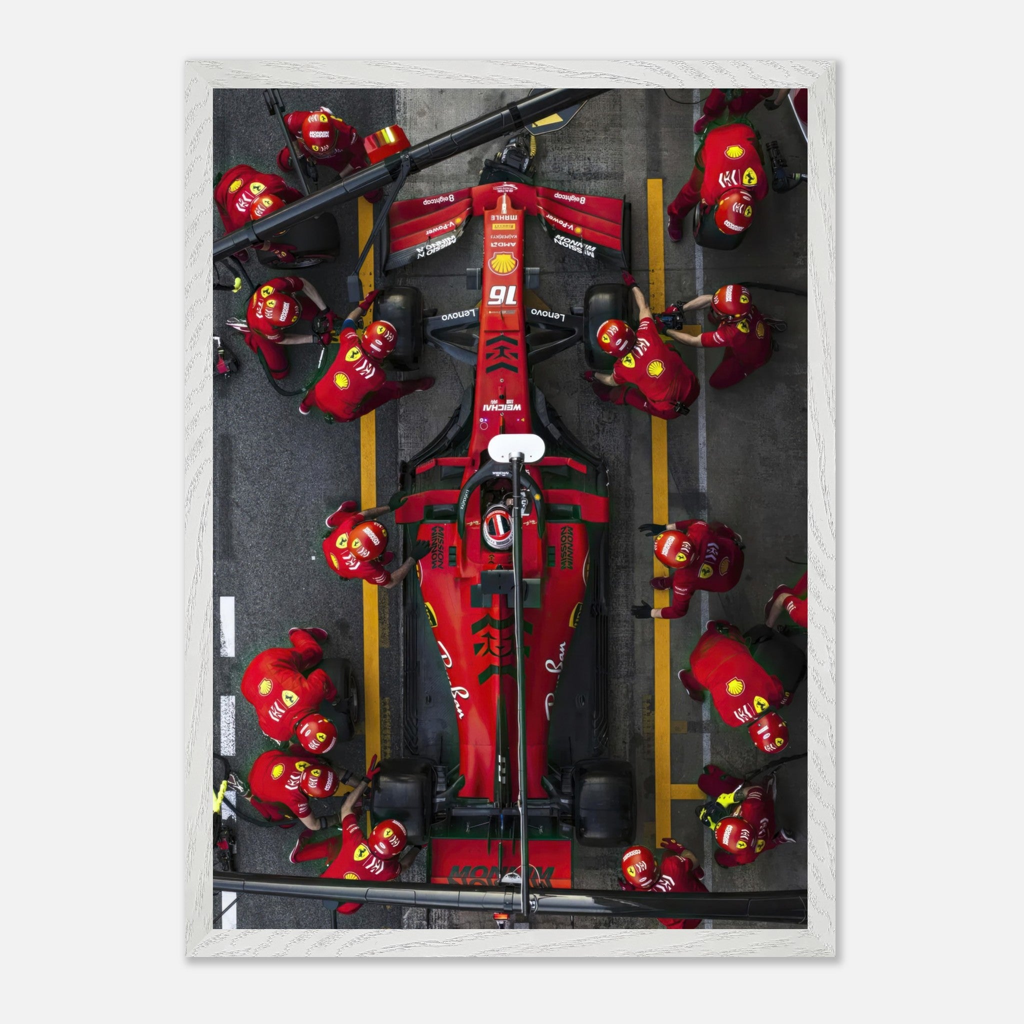 Framed fine art print of Ferrari Formula 1 pitstop, showcasing teamwork and precision in vivid colors and details.