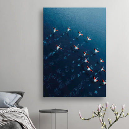 Stunning aerial view of flamingos over a deep blue water in a drone photography poster.