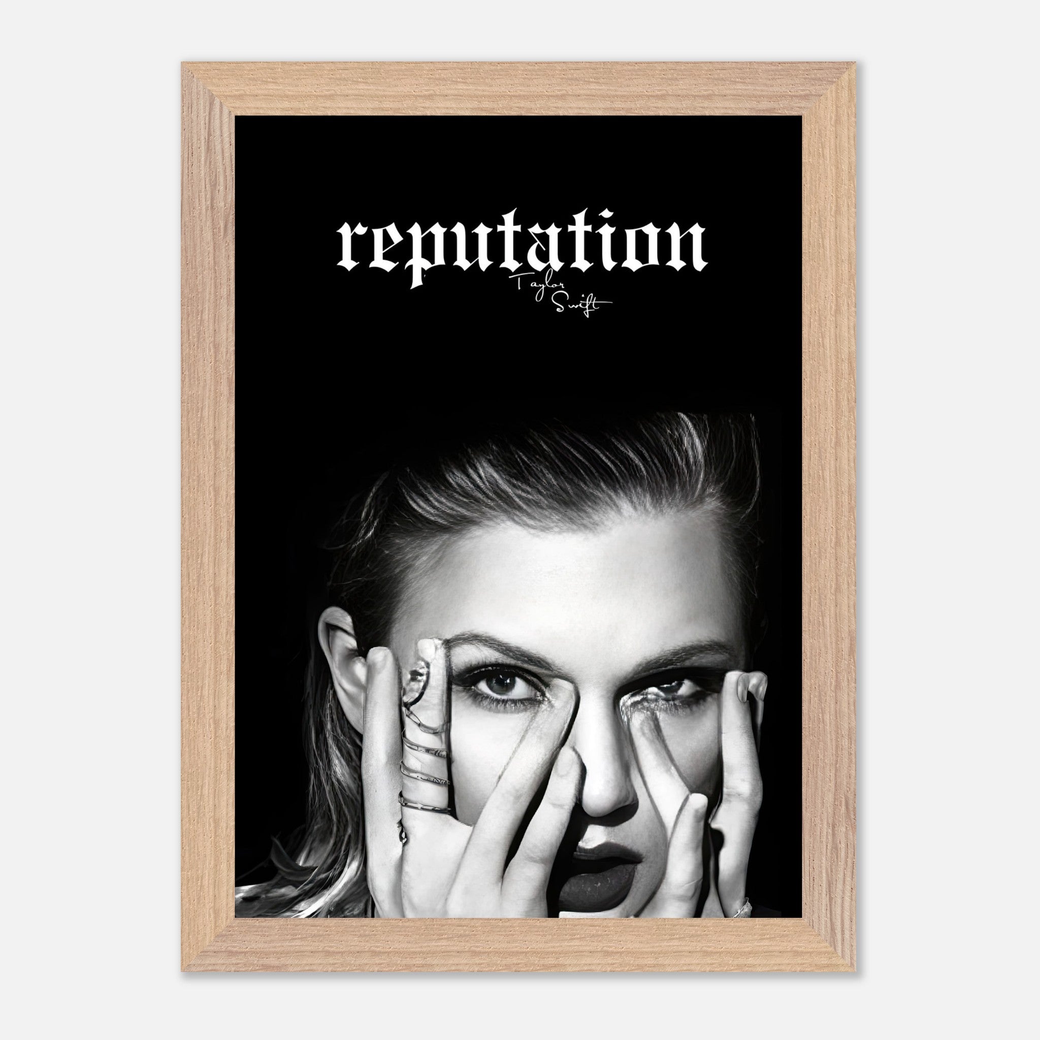 Vintage framed print of Taylor Swift’s Reputation era featuring a monochrome portrait and bold text.