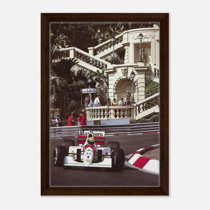 Framed canvas print of Ayrton Senna racing in Monaco, showcasing vibrant colors and dynamic motorsport artistry.