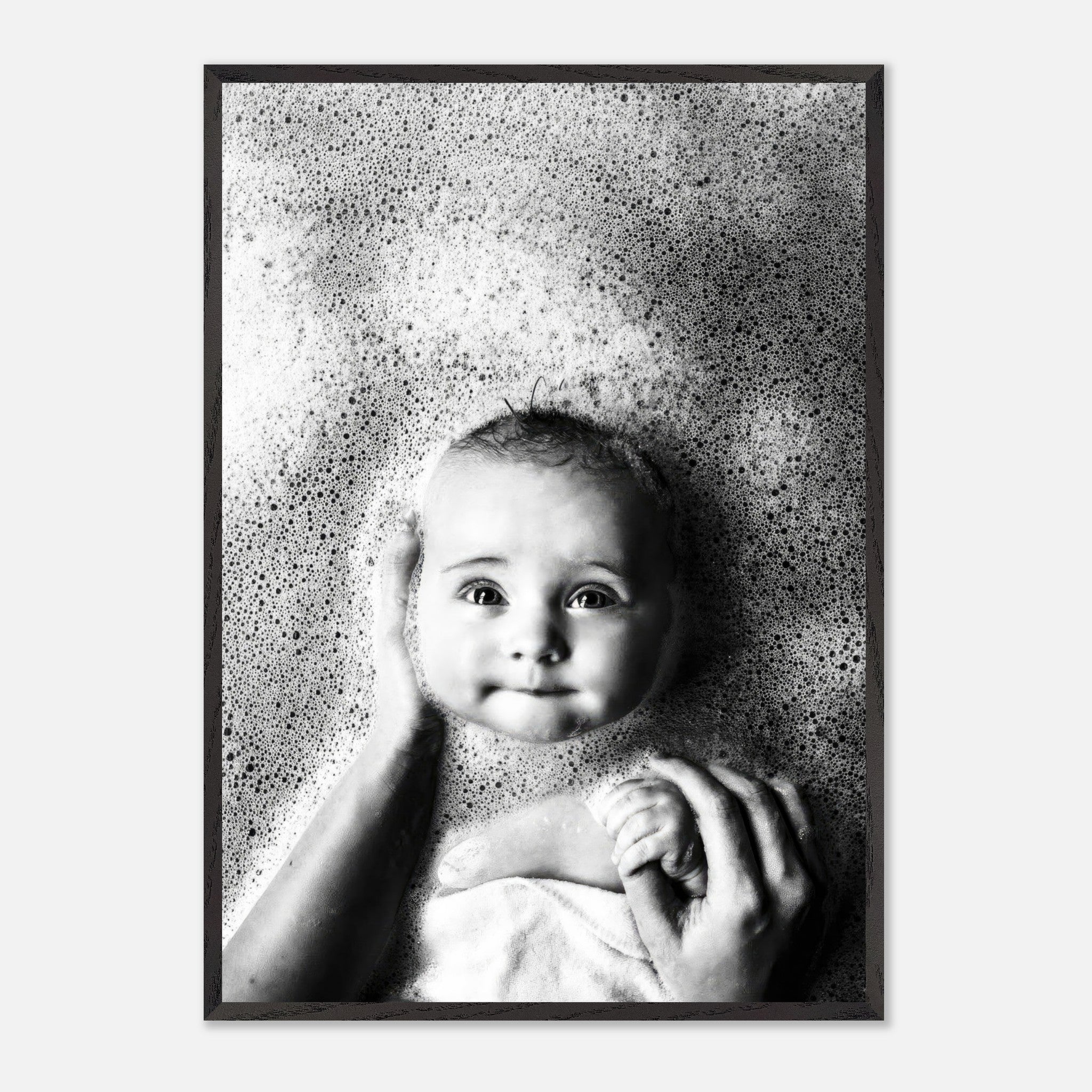 Black and white vintage print of a serene baby surrounded by bubbles, showcasing innocence and nostalgia.