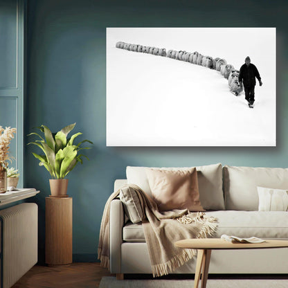 The Shepherd’s Trail Metal Print featuring a shepherd with flock in a snow-covered landscape, black-and-white art.