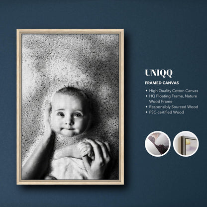 Baby bath photography framed canvas print featuring a serene baby surrounded by gentle bubbles.