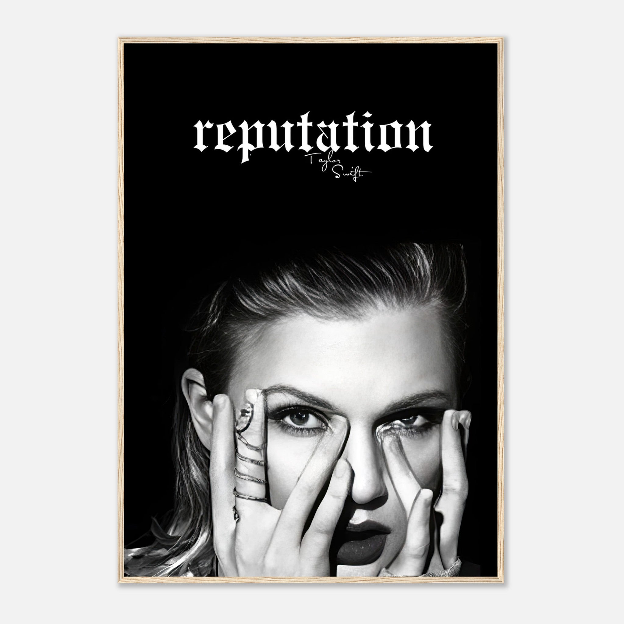 Taylor Swift Reputation framed print featuring striking black-and-white imagery and bold lettering on a minimalist background.