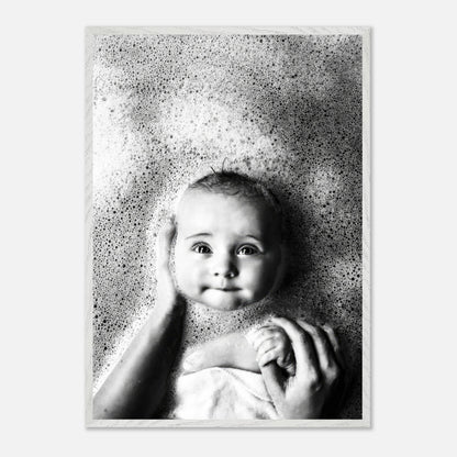 Vintage black and white baby bath photography with soft bubbles, capturing innocence and nostalgia.