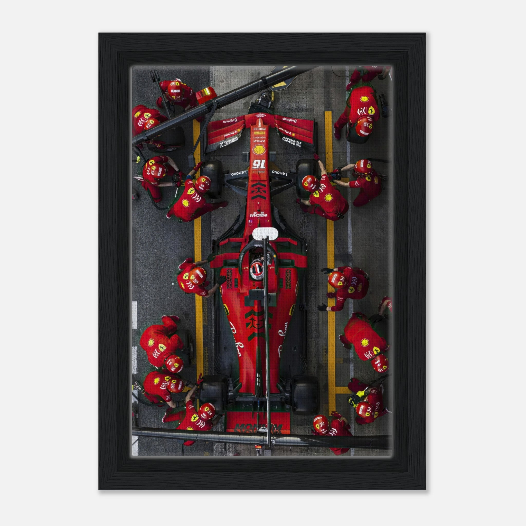 Thrilling Ferrari Formula 1 pitstop framed canvas print capturing vibrant colors and dynamic motorsport action.