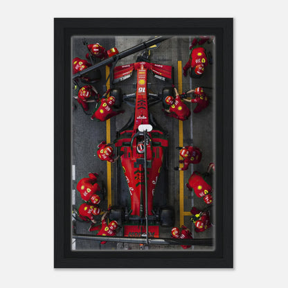 Thrilling Ferrari Formula 1 pitstop framed canvas print capturing vibrant colors and dynamic motorsport action.