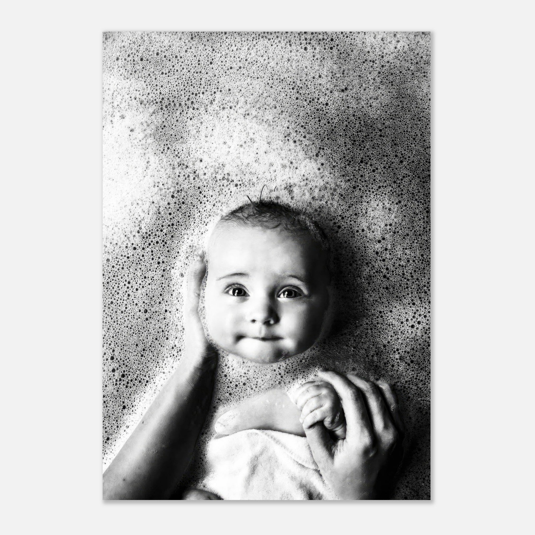Black and white poster of a serene baby in bubbles, capturing joy and innocence of bath time.