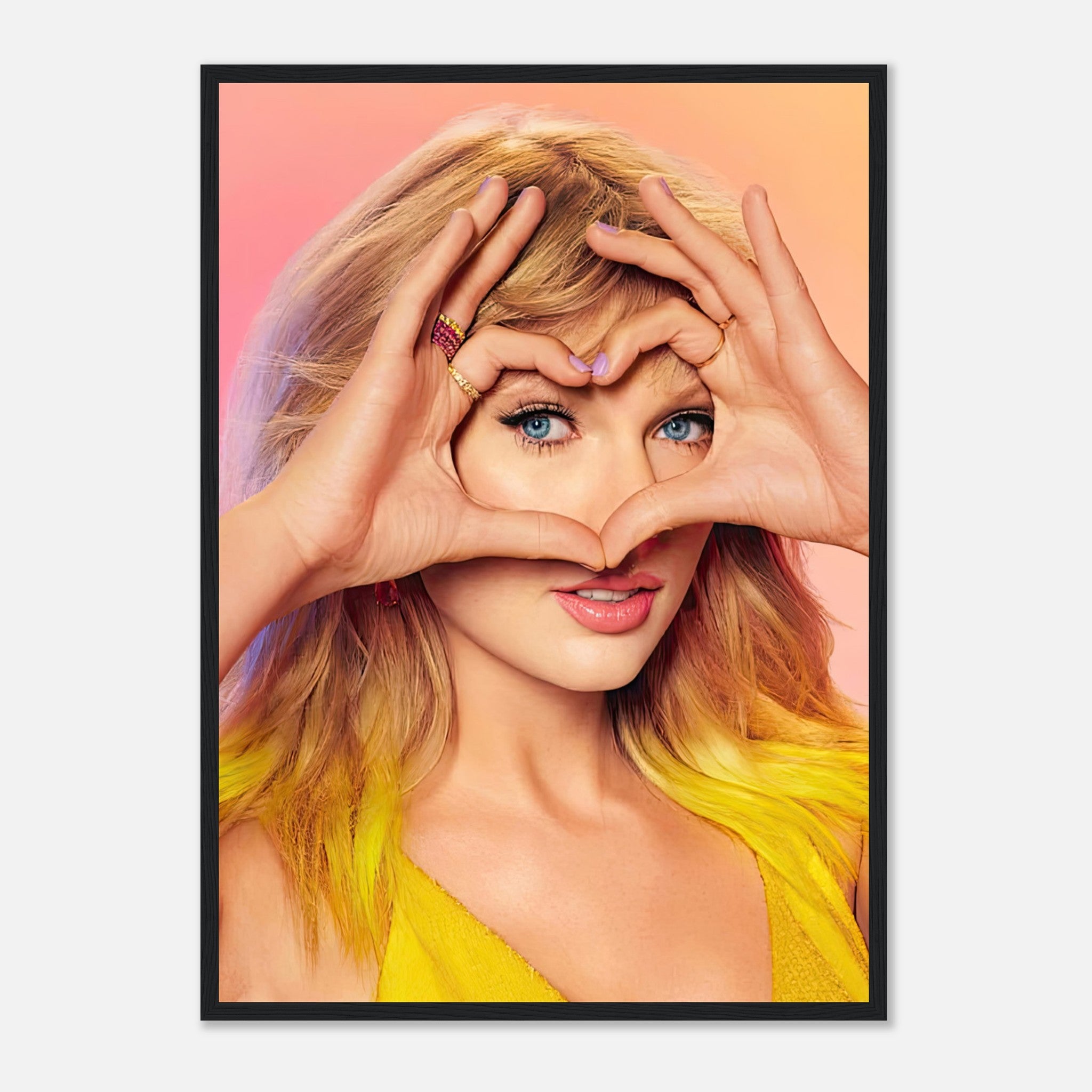 Taylor Swift framed print featuring her in a heart gesture with vibrant colors, perfect for music fans and home decor.