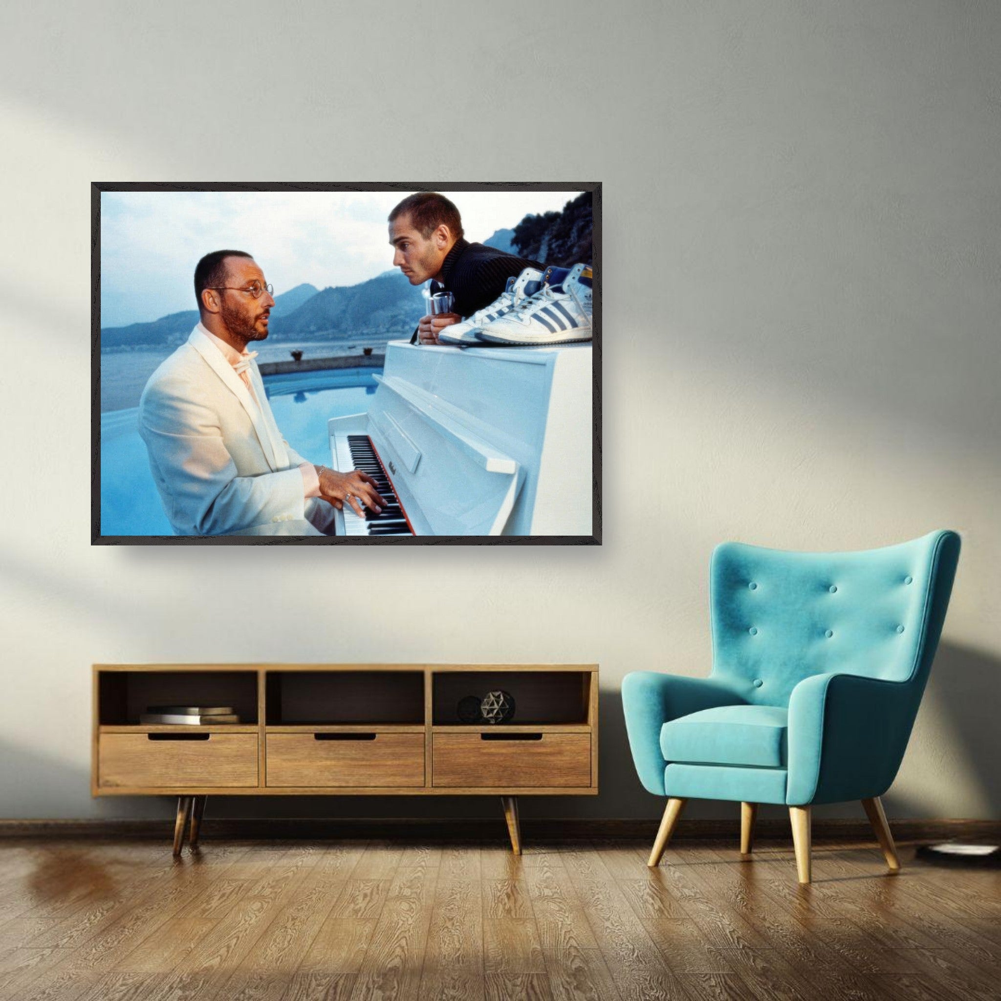 Vintage framed print of Jean Reno playing piano on the set of "The Big Blue" in a serene seaside backdrop.