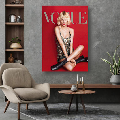 Taylor Swift Vogue metal print art on a wall, showcasing her iconic look against a vibrant red background.