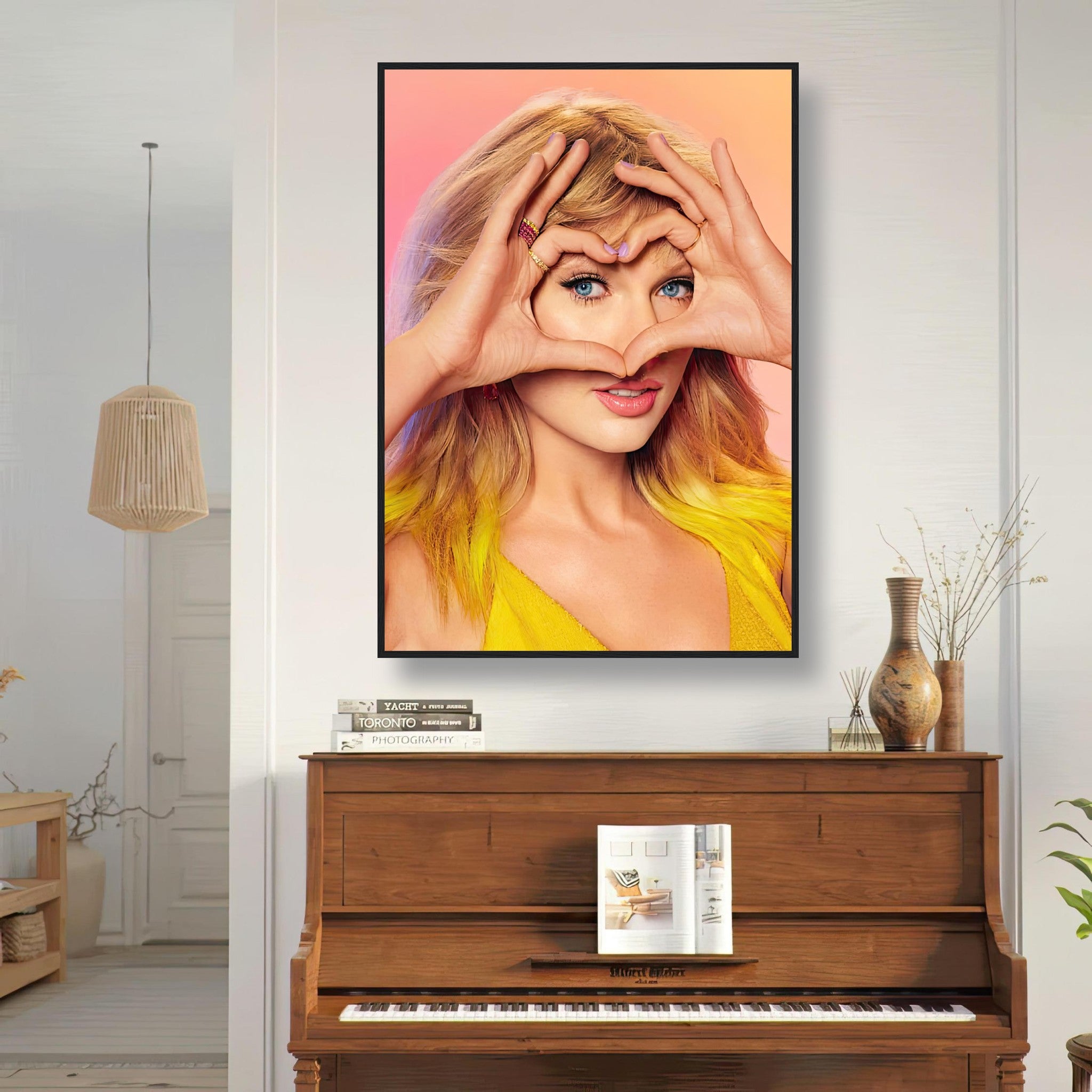 Taylor Swift Fan Love framed print showcasing vibrant colors and her signature heart gesture in a stylish room setting.