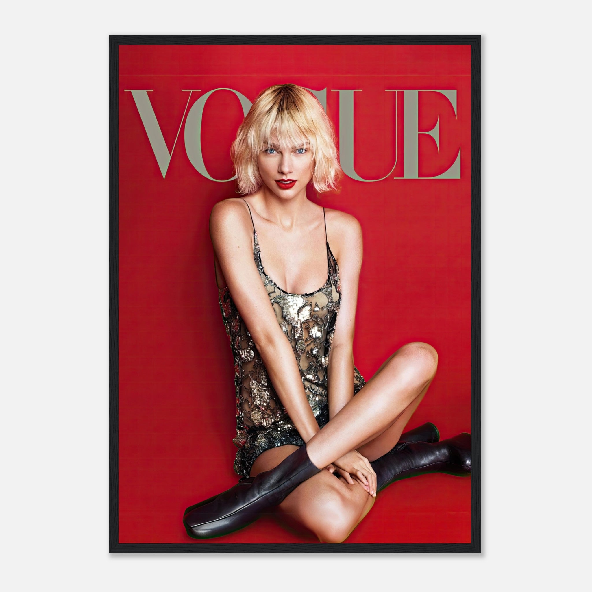 Taylor Swift Vogue framed poster featuring her in a metallic sequined dress against a striking red background.