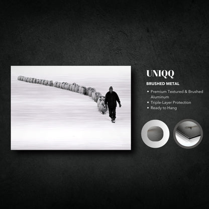 The Shepherd's Trail Brushed Metal artwork featuring a shepherd walking with sheep in a snowy landscape.