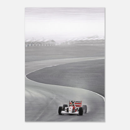 Ayrton Senna racing in a McLaren on track, captured in stunning brushed metal photography from 1988.