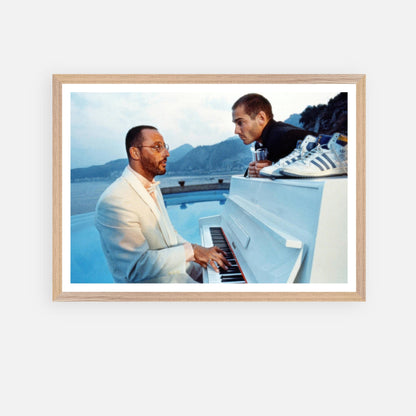 Jean Reno Piano Fine Art Print featuring a serene poolside performance with stunning coastal backdrop.