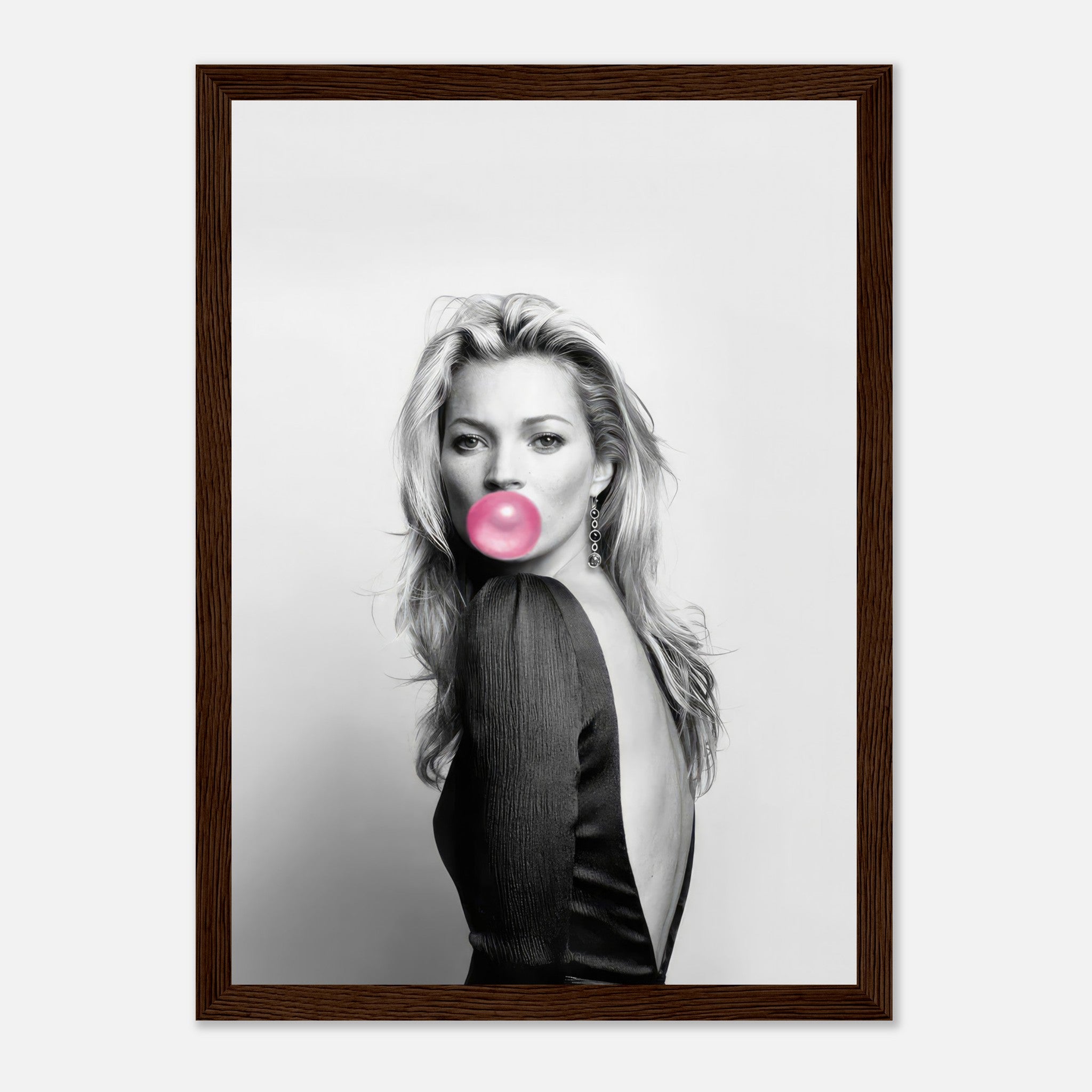 Black-and-white portrait of Kate Moss blowing bubble gum, framed print with modern chic style.