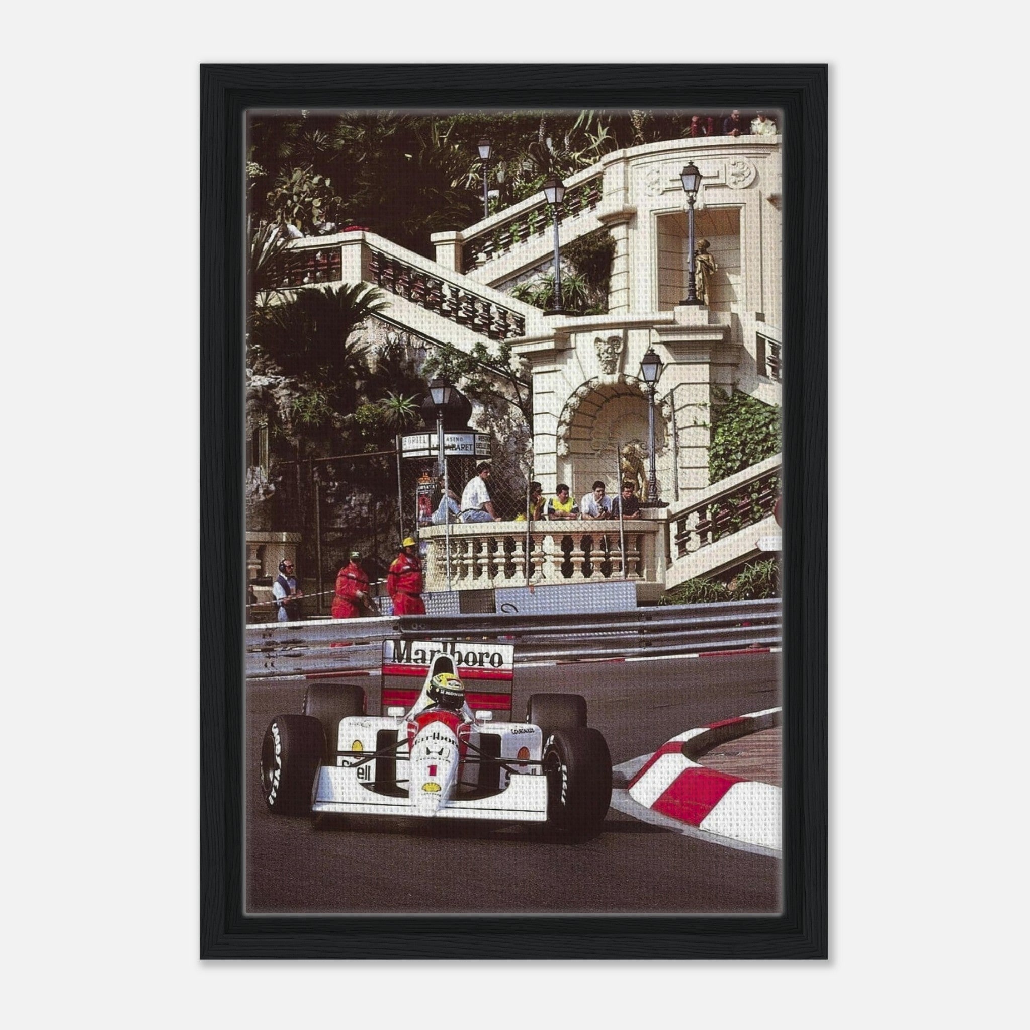 Framed canvas print of Ayrton Senna racing in Monaco, showcasing vibrant colors and iconic motorsport scenery.