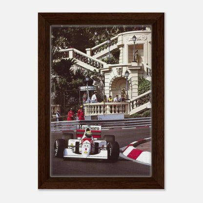 Framed canvas print of Ayrton Senna racing at Monaco, showcasing vibrant colors and masterful detail for motorsport enthusiasts.