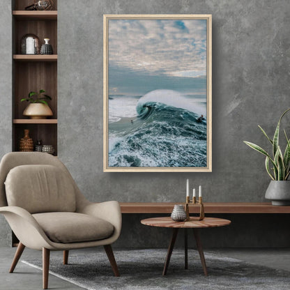 Big Wave Surfing framed canvas print showcasing a surfer riding a massive wave in a stylish living room setting.