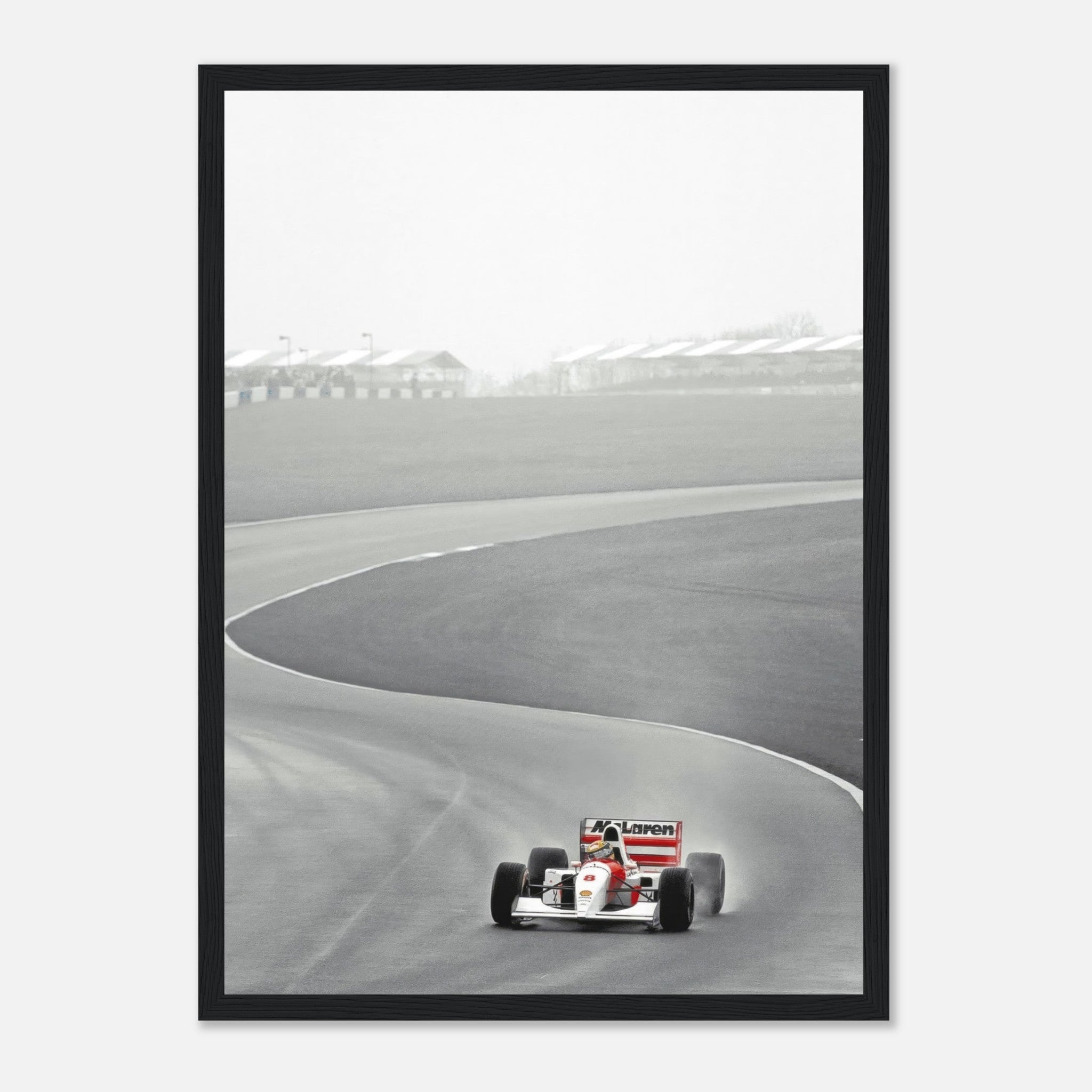 Framed print of Ayrton Senna driving the McLaren MP4/4 during the 1988 Formula 1 season on a racetrack.