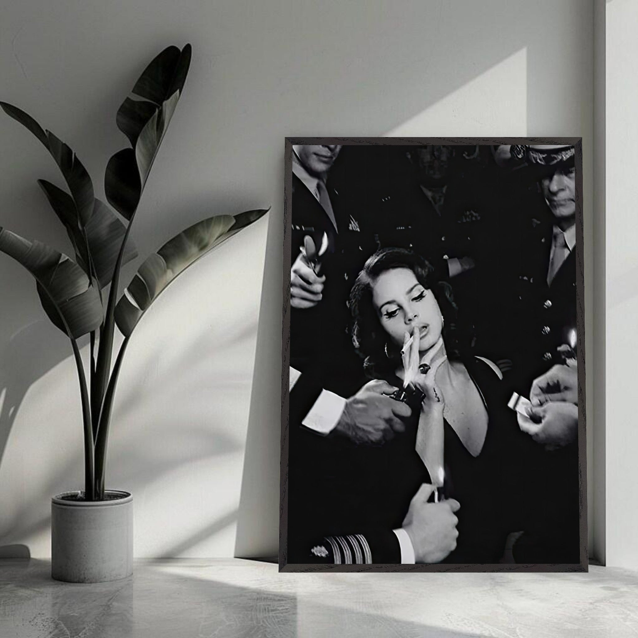 Lana Del Ray smoking in a vintage black-and-white framed print, showcasing elegance and timeless charm in a stylish interior setting.