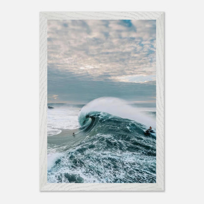 Big wave surfing fine art print featuring a surfer riding a colossal wave under a moody sky.