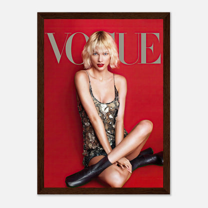 Framed Taylor Swift Vogue poster featuring her in a sequined dress against a striking red background.