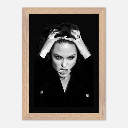 Vintage framed print of Angelina Jolie smoking, showcasing her bold charisma in striking black-and-white.