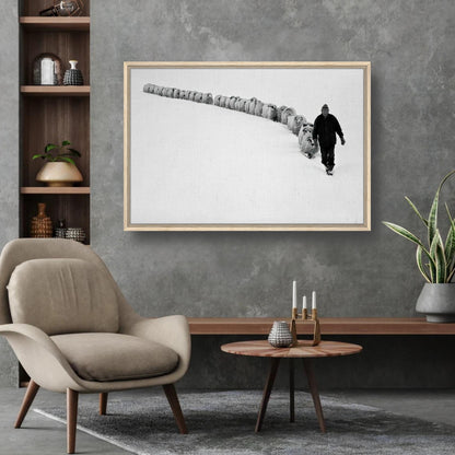 A framed canvas print depicting a shepherd walking with his flock in a snow-covered landscape.