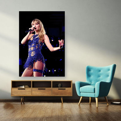 Taylor Swift performing in a dazzling blue outfit, featured in a vibrant photo poster for fans to decorate their space.