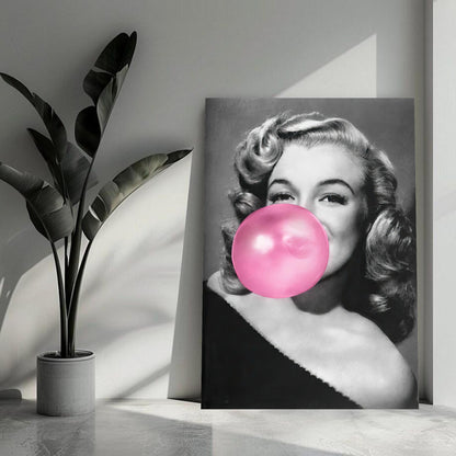 Marilyn Monroe blowing pink bubble gum in stylish metal print, adding iconic charm to modern decor.