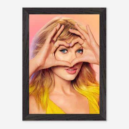 Taylor Swift vintage framed print featuring her making a heart shape with hands, celebrating fan love.