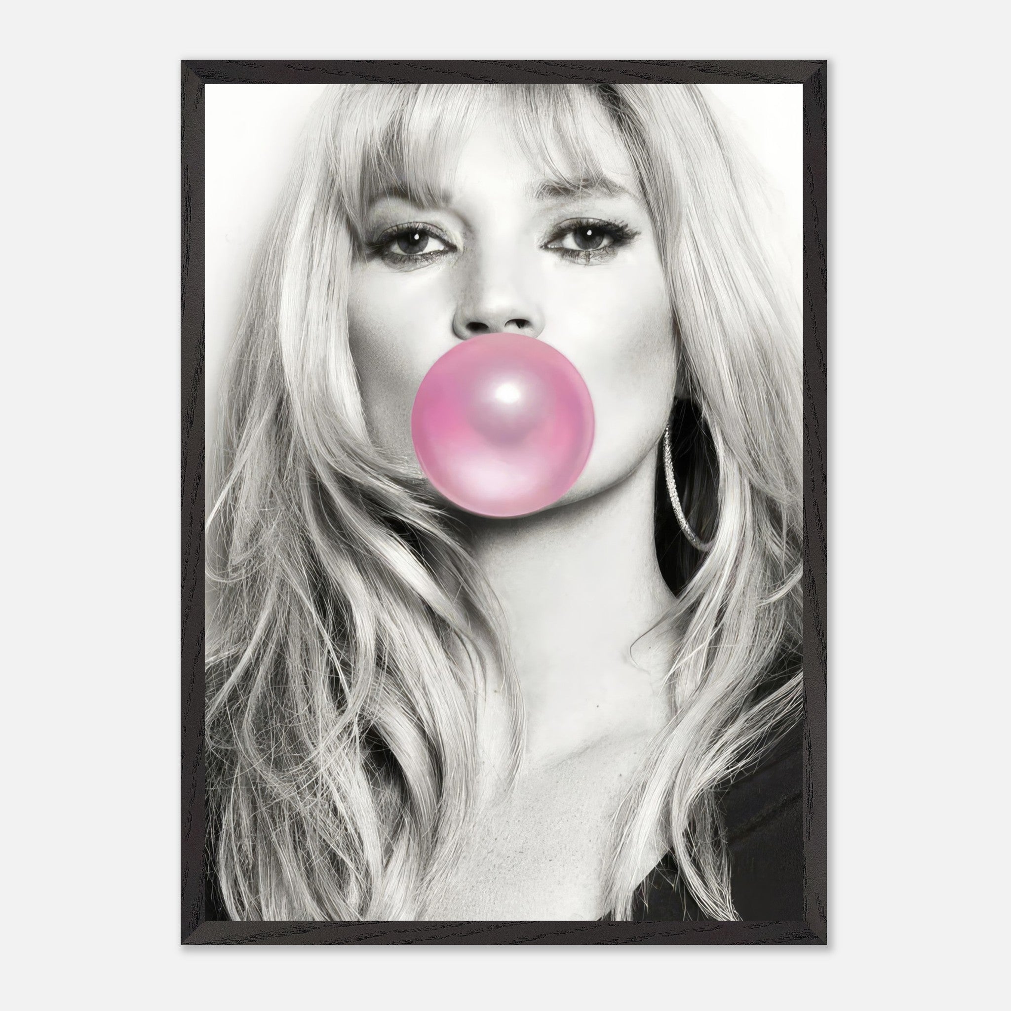 Vintage framed print of a black-and-white portrait of a woman blowing pink bubble gum, adding a playful touch to modern decor.