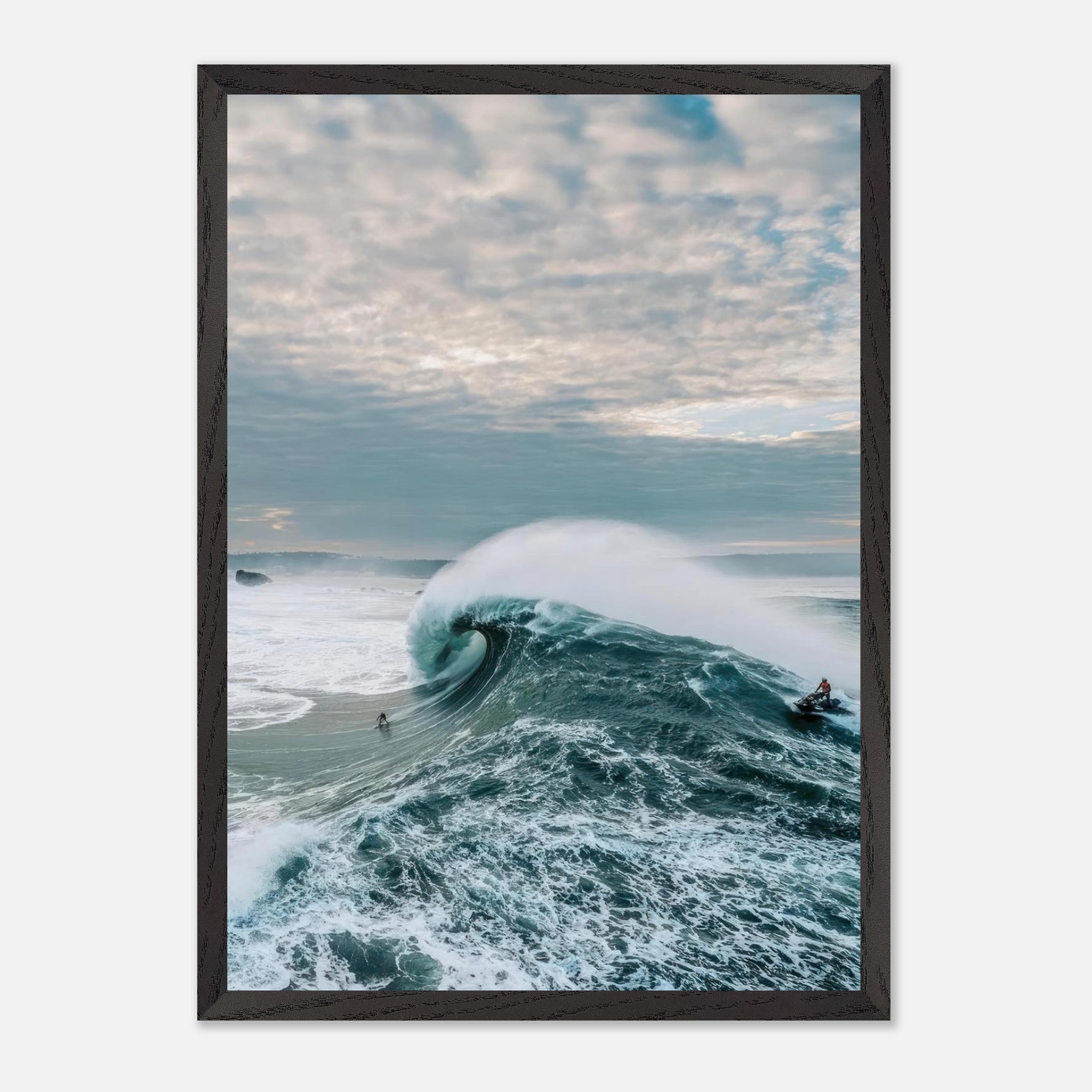 Dramatic fine art print of a surfer riding a massive wave under a moody sky, capturing the ocean's raw power.