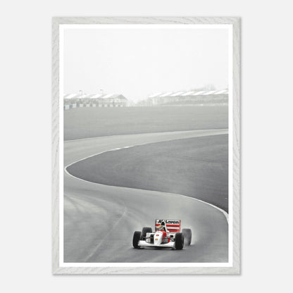 1988 Ayrton Senna driving McLaren MP4/4 on track, vintage framed art capturing Formula 1's iconic moment.