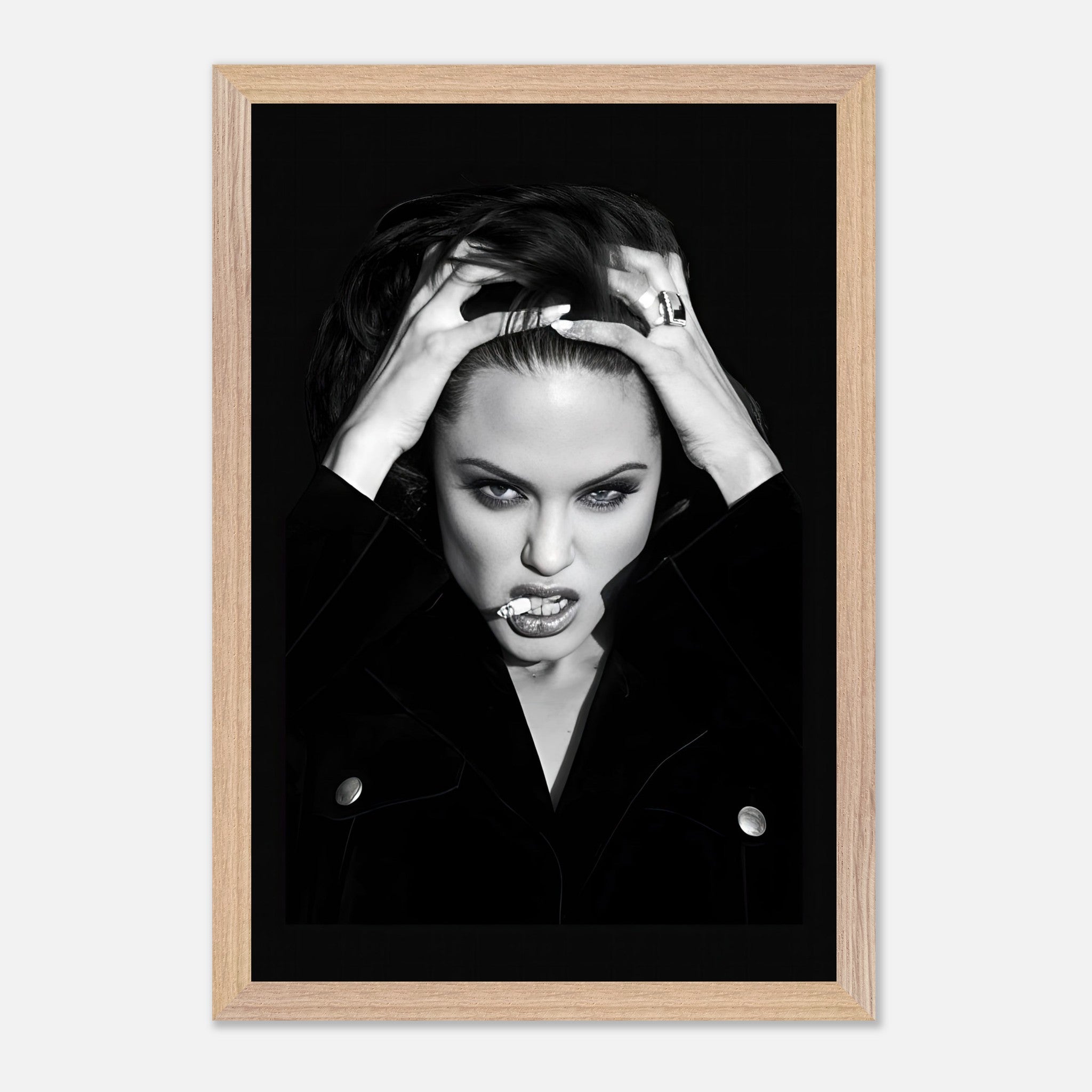 Black-and-white vintage framed print of a bold woman exuding Hollywood glamor and confidence.