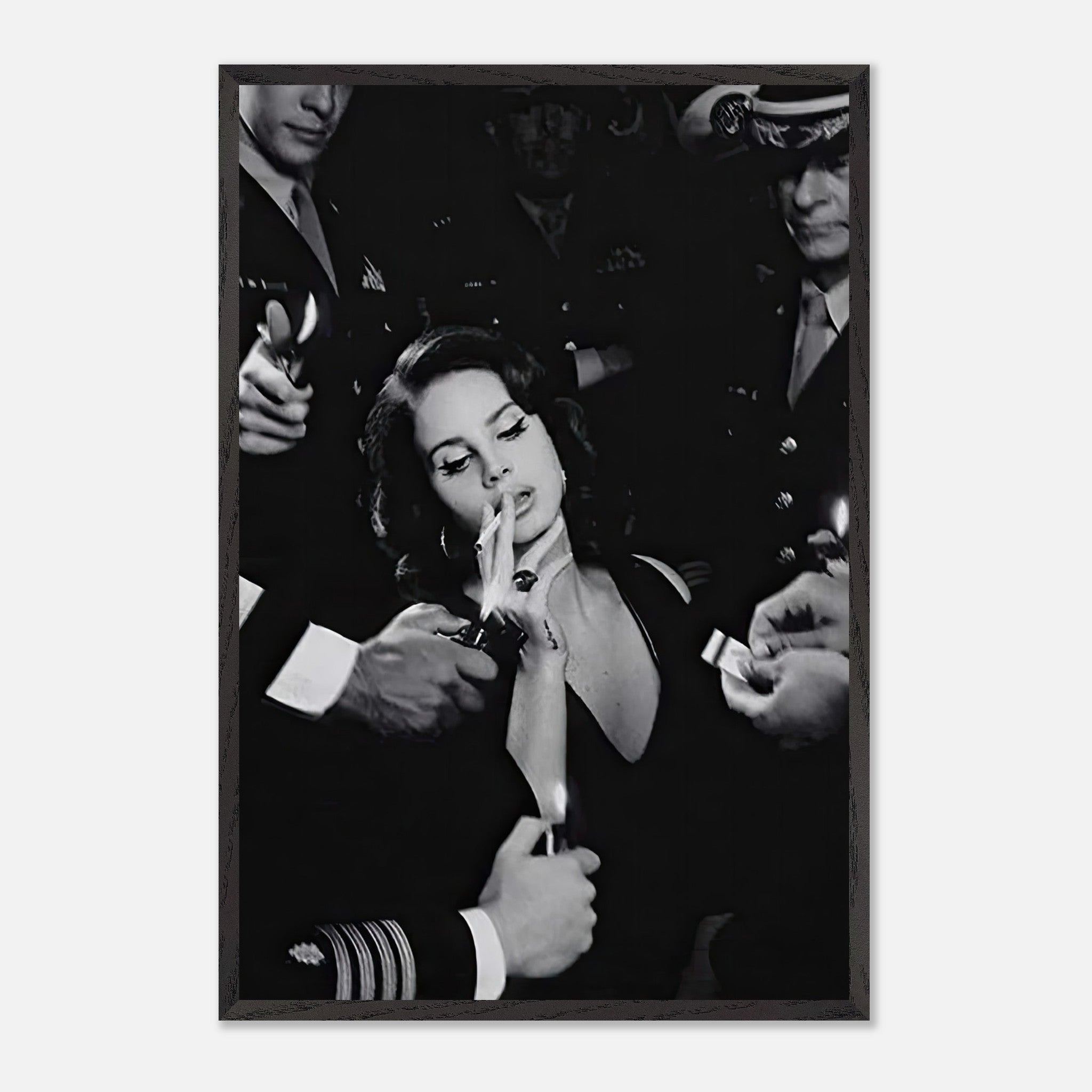 Black and white vintage print of Lana Del Rey smoking surrounded by men in military uniforms, exuding elegance.