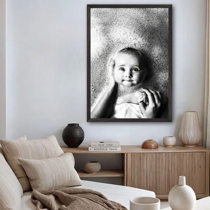 Black-and-white fine art print of a joyful baby in a bath, capturing innocence and serenity in home decor.