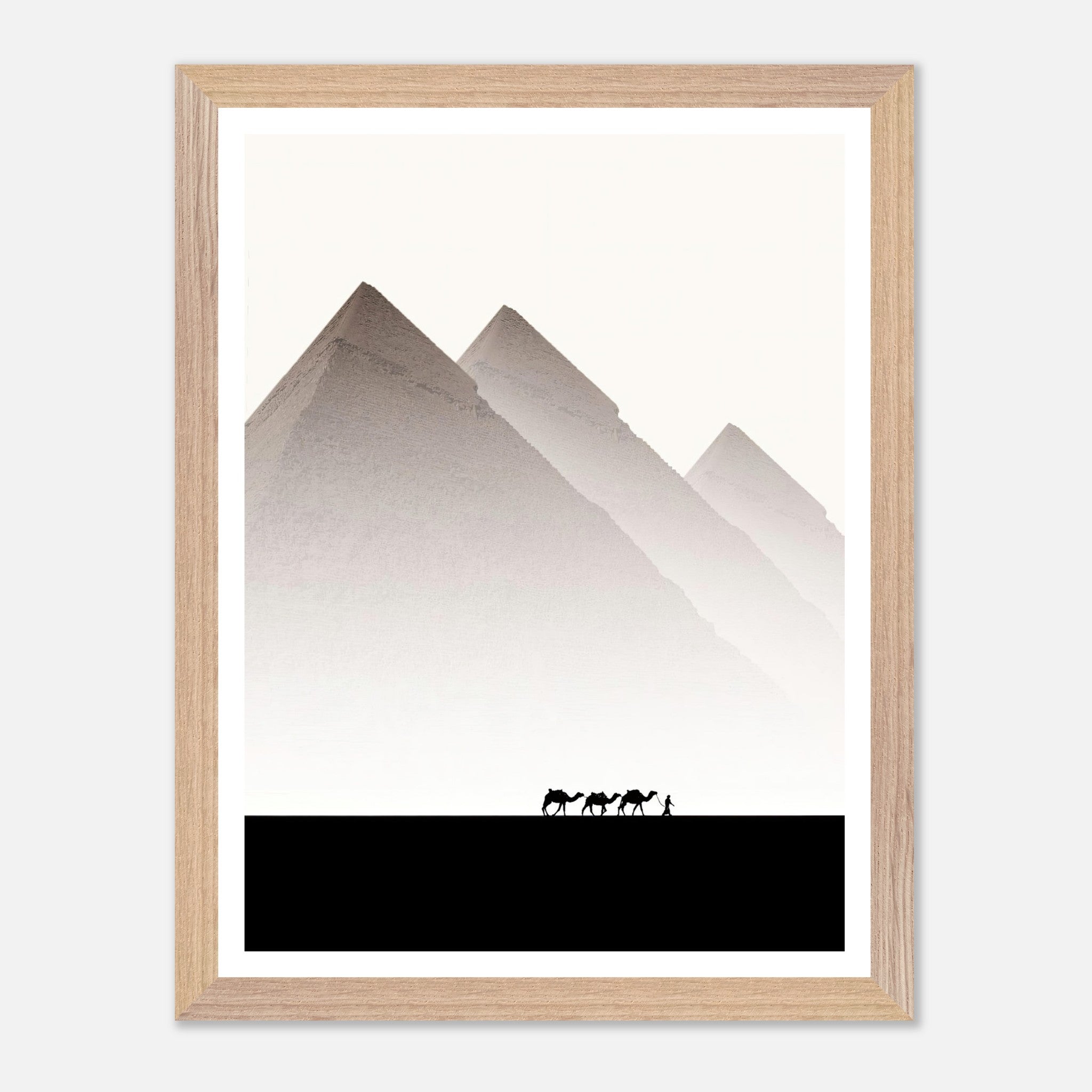 Framed travel photography of the Pyramids of Giza with camels against a soft, muted sky, perfect for home decor.