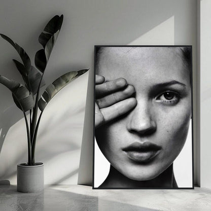 Black and white framed print of Kate Moss with a striking close-up portrait, enhancing modern home décor.