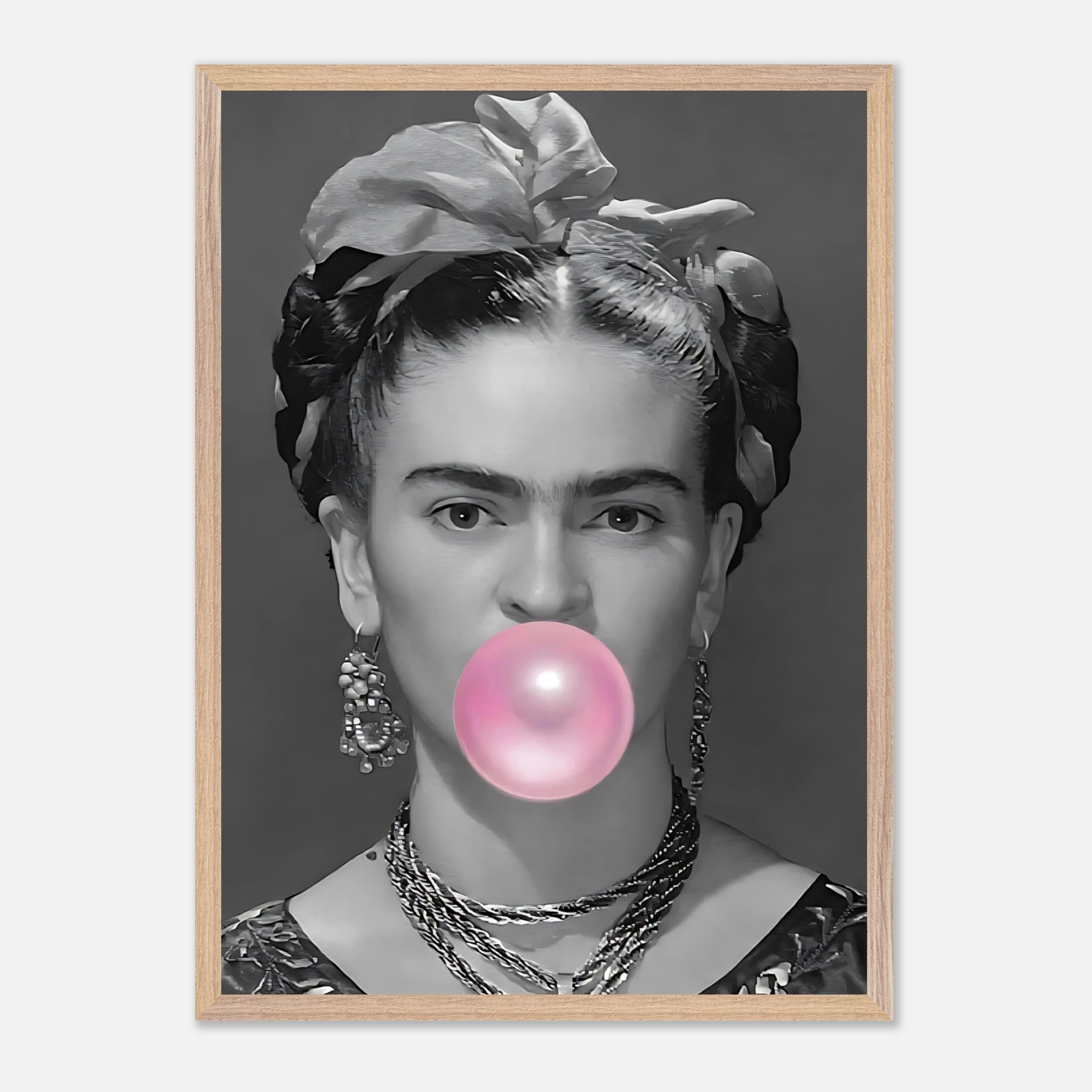 Frida Kahlo vintage art framed print featuring her blowing pink bubble gum in black-and-white photography.